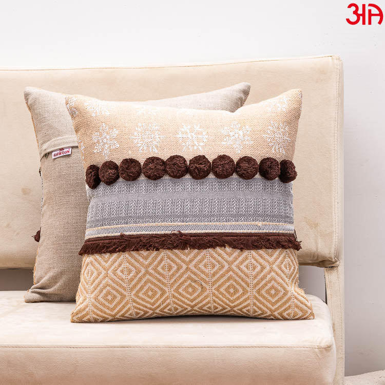 brown pompom cushion