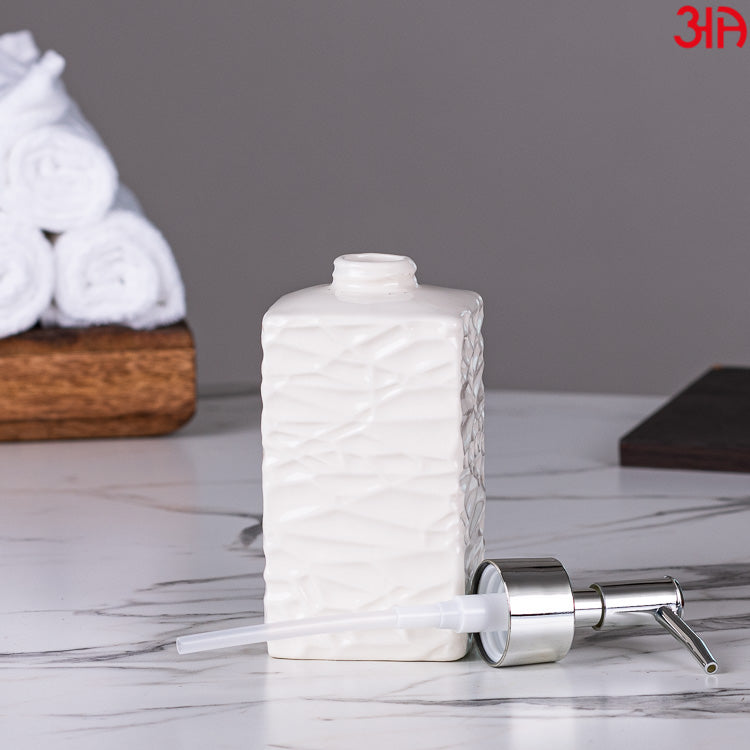 white ceramic soap dispenser with pump4