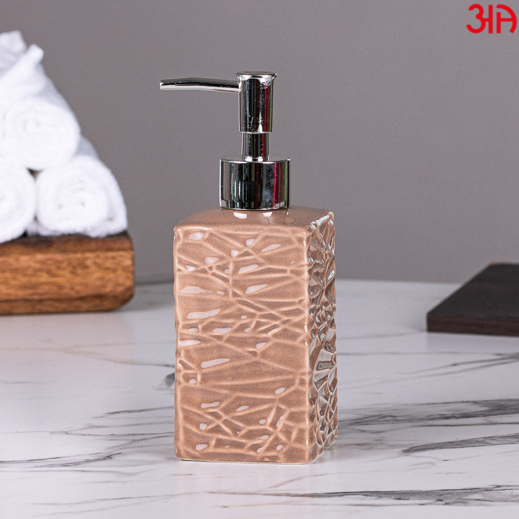 brown ceramic soap dispenser with pump