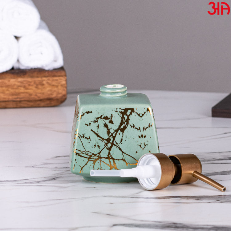 green ceramic soap dispenser