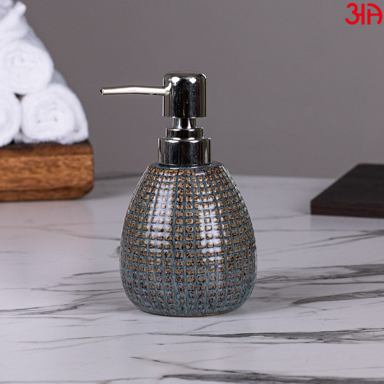 brown ceramic soap dispenser