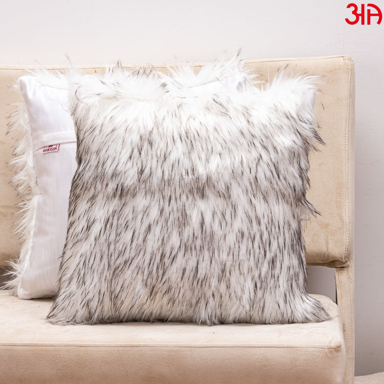 white-grey furry cushion