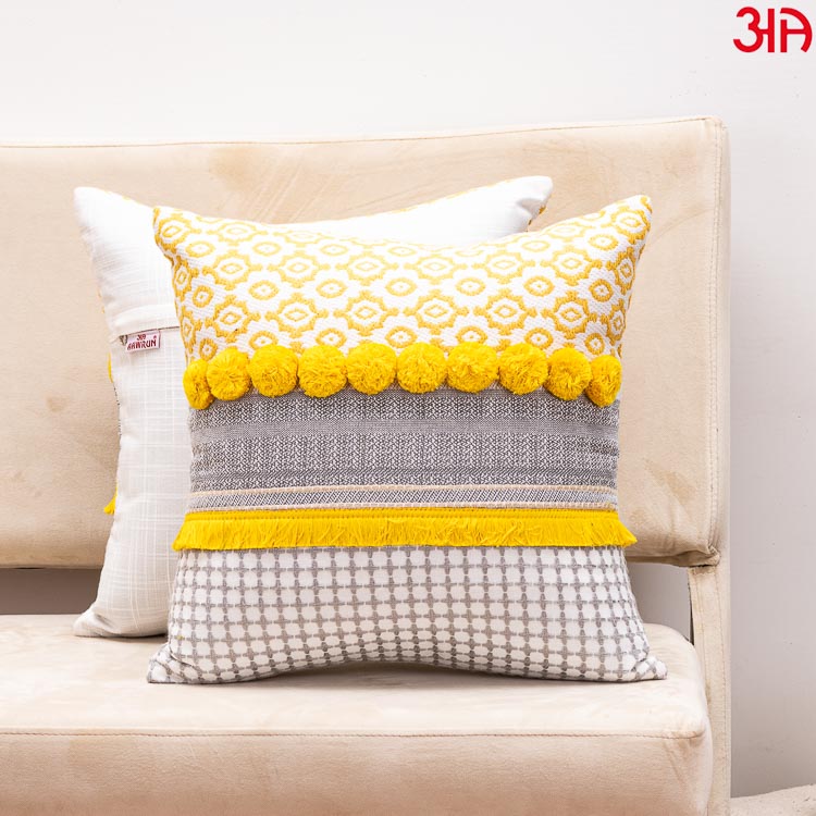 yellow pompom cushion