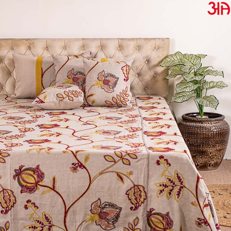 Beige cotton bedcover with red and yellow floral work