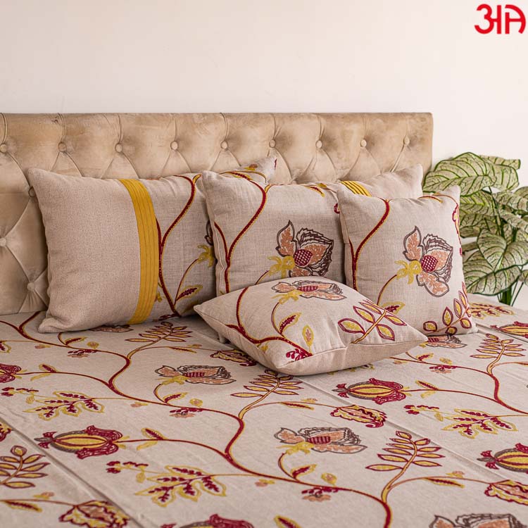 Beige cotton bedcover with red and yellow floral work