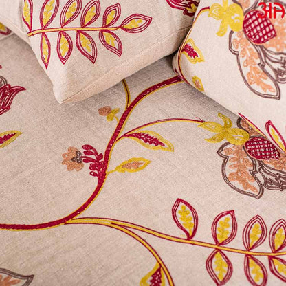 Beige cotton bedcover with red and yellow floral work