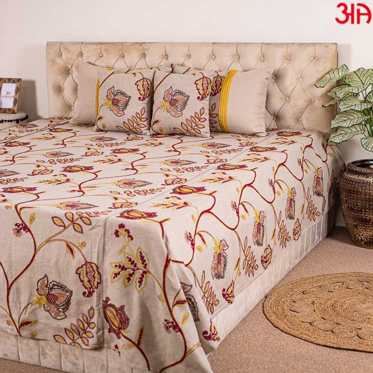 Beige cotton bedcover with red and yellow floral work