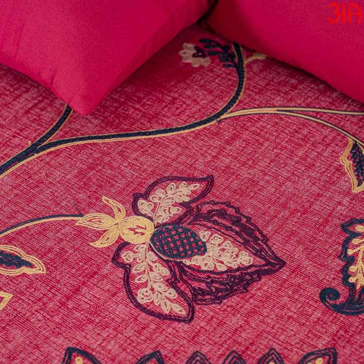 Red cotton bedcover with leaf and flower design