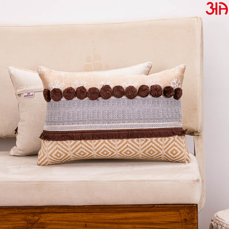 brown pompom cushion 12x18