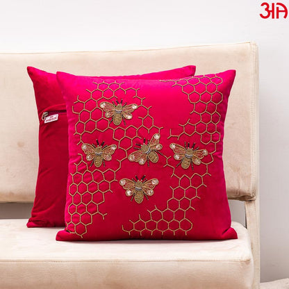 magenta bee design cushion